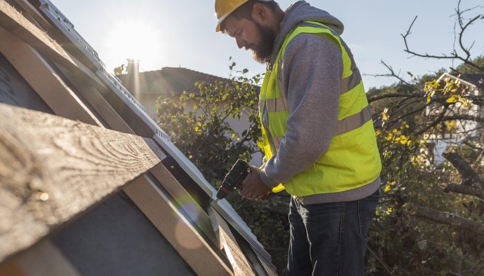 man-working-roof-with-drill